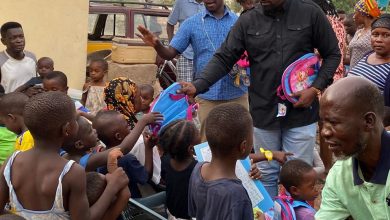 Photo of Photos: John Dumelo Donates Exercise Books, School Bags And Other Items To Kids At Roman Ridge In Accra