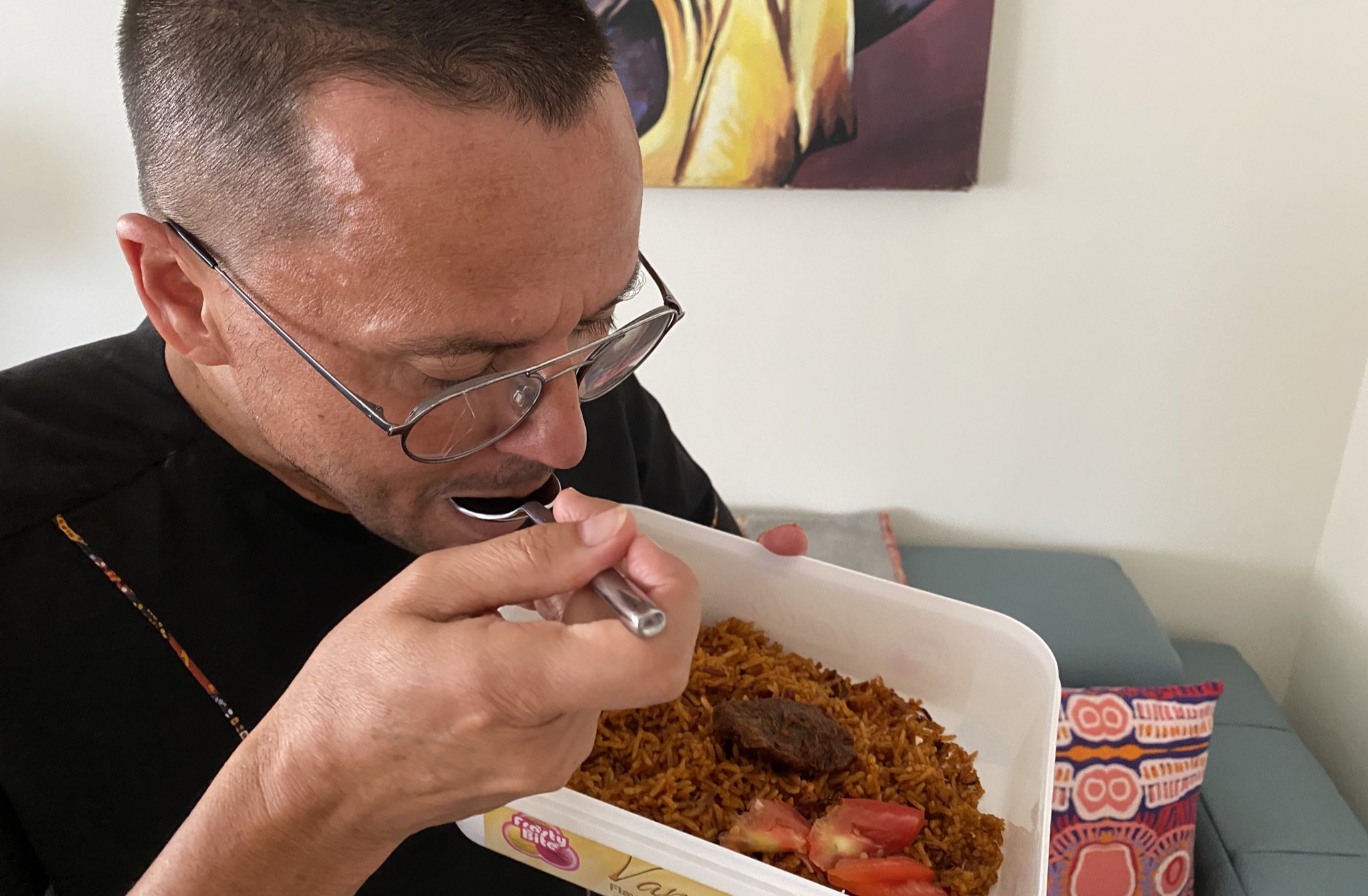 H.E Gregory Andrews Eating Ghana Jollof Rice